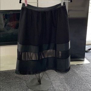 Black Fishnet skirt trimmed in faux leather